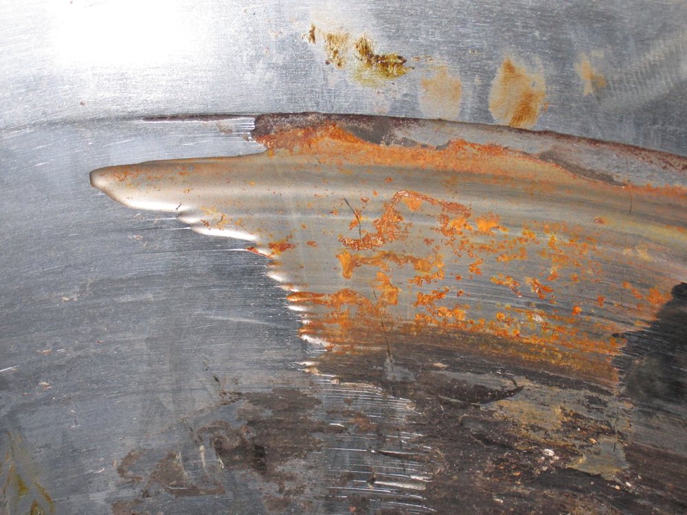 Worn rotary feeder plate